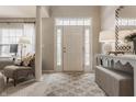 Bright entryway with tiled floor, stylish console table, and comfortable seating at 2342 The Springs Dr, Indianapolis, IN 46260