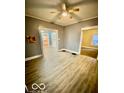 Bright living room features new floors, ceiling fan, and neutral paint scheme at 316 N Lasalle St, Indianapolis, IN 46201