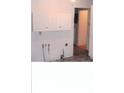 White cabinets, linoleum floor, and exposed plumbing at 3726/3722/3716 N Emerson Ave, Indianapolis, IN 46218