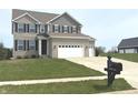 Well-maintained two-story home with a manicured lawn and mailbox at 373 Brianne Lane at 373 Brianne Ln, Danville, IN 46122