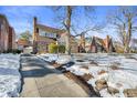 Snow-covered driveway leading to charming brick home at 5710 N Delaware St, Indianapolis, IN 46220