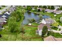 Aerial view showcasing the home's large backyard, pond, and serene surroundings at 861 Stardust Ct, Franklin, IN 46131
