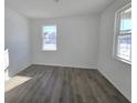Simple bedroom with hardwood floors and two windows at 8703 Duncan St, Fortville, IN 46040