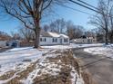 White house with black shutters, snow covered yard at 935 S Morgantown Rd, Greenwood, IN 46143