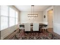 Bright dining room featuring a wood table and white chairs at 11474 Loch Raven Blvd, Fishers, IN 46037