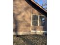 Brown wooden siding with screened porch and foundation at 1420 W 23Rd St, Indianapolis, IN 46208