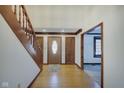 Elegant entryway with hardwood floors and wooden doors at 179 W Arcadia Way, Mooresville, IN 46158