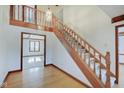 Grand wooden staircase with chandelier in a spacious foyer at 179 W Arcadia Way, Mooresville, IN 46158