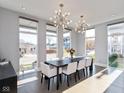 Sunlit dining room featuring a large table and statement lighting at 1948 Central Ave, Indianapolis, IN 46202