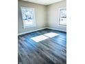 Spacious living area with gray walls and wood-look flooring at 2119 Noble St, Anderson, IN 46016