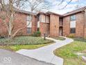 Brick building with landscaped walkway, offering a charming and welcoming entrance at 2224 Boston Ct # A, Indianapolis, IN 46228