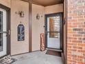 Welcoming front entry with inviting decor, and brick accent wall at 2224 Boston Ct # A, Indianapolis, IN 46228