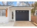 A close-up view of the home's garage featuring a modern door with window panes at 2615 12Th St, Columbus, IN 47201