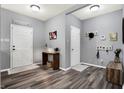 Bright entryway with gray walls, wood-look floors, and storage at 3174 Hemlock St, Whiteland, IN 46184