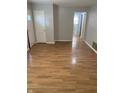 Bright and airy living area with laminate floors and access to other rooms at 5778 E 30Th St, Indianapolis, IN 46218