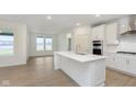 Bright kitchen with stainless steel appliances and large island at 7419 Legends Way, Whitestown, IN 46052