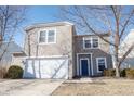 Two-story house with a white garage door and blue front door at 9286 W Quarter Moon Dr, Pendleton, IN 46064