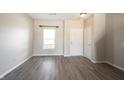 Living room with gray vinyl flooring and white walls at 9286 W Quarter Moon Dr, Pendleton, IN 46064