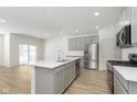 Modern kitchen with stainless steel appliances and large island at 9703 Behner Dr, Fishers, IN 46250