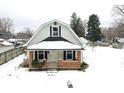 Aerial view of a charming house with snow covered yard at 1175 Central Ave, Noblesville, IN 46060