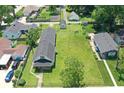 An aerial view showcasing a home with a spacious lawn, mature trees, and a peaceful residential setting at 1175 Central Ave, Noblesville, IN 46060