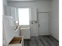 New kitchen with white cabinets and vinyl plank flooring at 2033 Carrollton Ave, Indianapolis, IN 46202