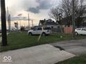 Side view of the house with parking and a street visible at 2165 S Meridian S St, Indianapolis, IN 46225
