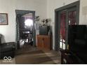 Living room with a view into the kitchen and access to another room at 2165 S Meridian S St, Indianapolis, IN 46225