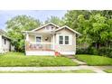 Charming single-story home featuring a cozy front porch and well-maintained lawn at 361 S Spencer Ave, Indianapolis, IN 46219