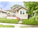 Charming single-story home featuring a cozy front porch and well-maintained lawn at 361 S Spencer Ave, Indianapolis, IN 46219