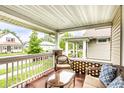 Inviting covered porch with comfortable seating, perfect for relaxing outdoors at 361 S Spencer Ave, Indianapolis, IN 46219