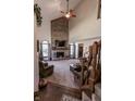 Spacious living room with a large brick fireplace and hardwood floors at 3819 S Village Dr, New Palestine, IN 46163
