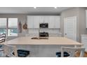 Spacious kitchen featuring white cabinets and quartz countertops at 5246 Parkhurst Xing, McCordsville, IN 46055