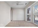 Bright bedroom with large windows and ceiling fan at 588 E Vermont St, Indianapolis, IN 46202