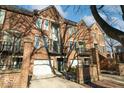 Brick townhome with attached garage and balcony at 588 E Vermont St, Indianapolis, IN 46202