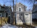 Rear view of gray house with a small addition at 1053 W 35Th St, Indianapolis, IN 46208