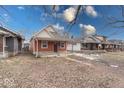 Quaint bungalow home with a landscaped yard at 117 N Sheffield Ave, Indianapolis, IN 46222