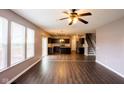 Open-concept living area seamlessly connects to the kitchen, featuring modern flooring and ample natural light at 1284 Jesse Ct, Greenwood, IN 46143
