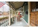 Charming front porch featuring rocking chairs, decorative woodwork, and a classic, welcoming ambiance at 1468 Alabama St, Indianapolis, IN 46202