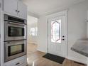 Modern kitchen with double oven and a stained glass door at 1602 S P St, Elwood, IN 46036