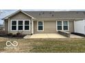 Backyard featuring a concrete patio and well-maintained lawn at 17238 Falkland Dr, Westfield, IN 46074