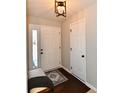 Bright entryway with hardwood floors, white doors, and a bench at 17238 Falkland Dr, Westfield, IN 46074