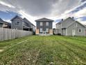 A home with an ample-sized lawn and fenced backyard, perfect for outdoor activities and relaxation at 2035 Carrollton Ave, Indianapolis, IN 46202