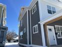 Side view of duplex showcasing gray siding and white trim at 2035 Carrollton Ave, Indianapolis, IN 46202