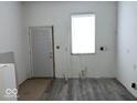 Renovated kitchen with new flooring and appliances at 2035 Carrollton Ave, Indianapolis, IN 46202