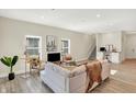 Spacious living room with light beige couch and modern decor at 3264 Orchard Ave, Indianapolis, IN 46218