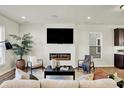 Living room with fireplace, hardwood floors, and large windows at 344 Evans St, Indianapolis, IN 46222