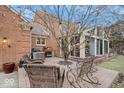 Secluded patio with brick paving, outdoor seating, and view of sunroom at 6551 Forrest Commons Blvd, Indianapolis, IN 46277