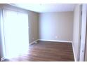 Bright dining area with sliding glass doors and wood-look flooring at 9903 E 17Th St, Indianapolis, IN 46229
