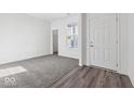 Bright bedroom with carpet and vinyl flooring, closet and natural light at 1020 Stonehaven Dr, Indianapolis, IN 46239